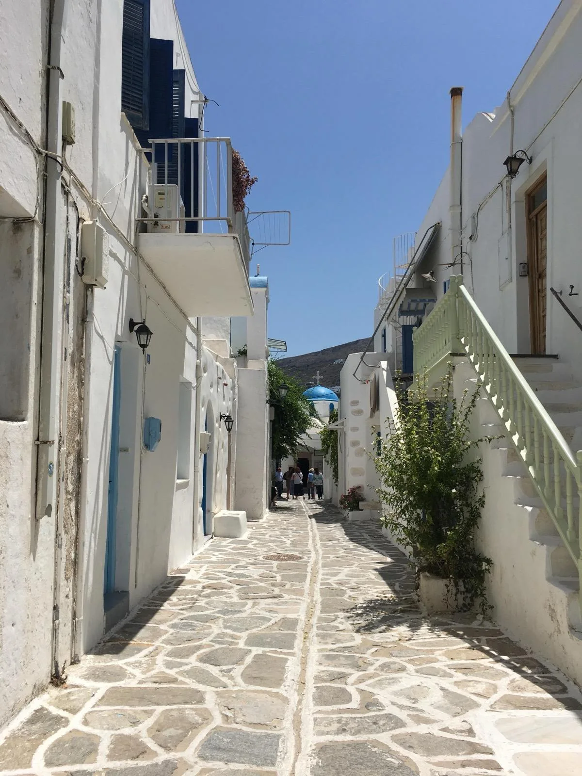 A whitewashed lane on Paros, its flagstones outlined in white